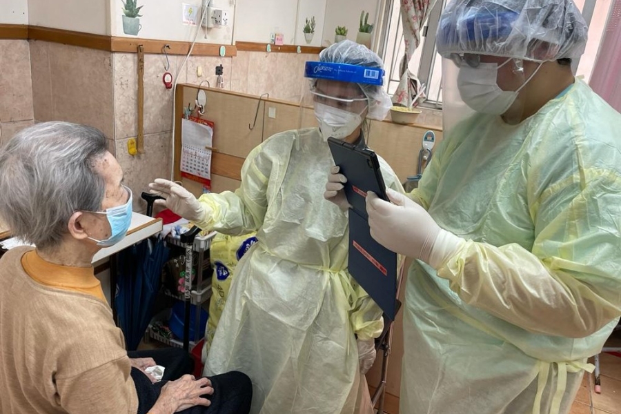 Outreach team members perform onsite assessments and caring procedures to residents of elderly home.