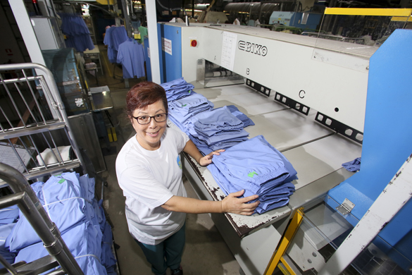 Chai Wan Laundry, where Cheung Kwai-har works, can handle up to 55,000 items of clothing a day.