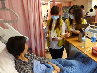 Volunteers promoting hand hygiene to patients at the Prince of Wales Hospital