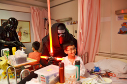Darth Vader distribute gifts to patients at the Paediatric Surgical and Orthopaedic Wards of the Prince of Wales Hospital
